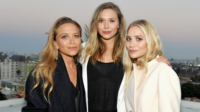 Elizabeth Olsen with Mary-Kate and Ashley Olsen