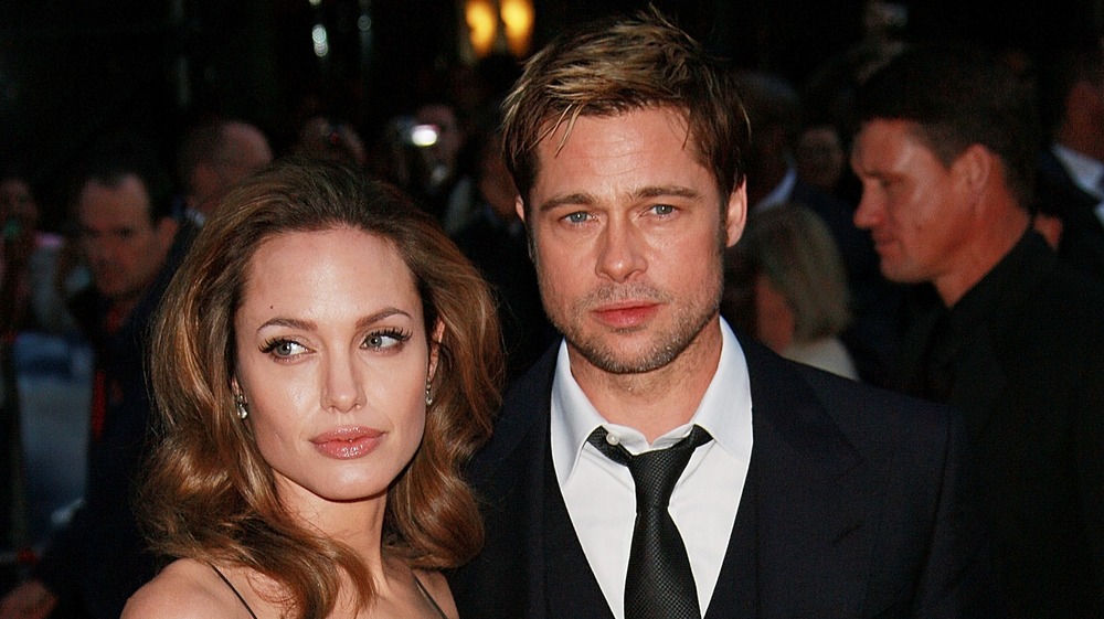 Angelina Jolie and Brad Pitt staring