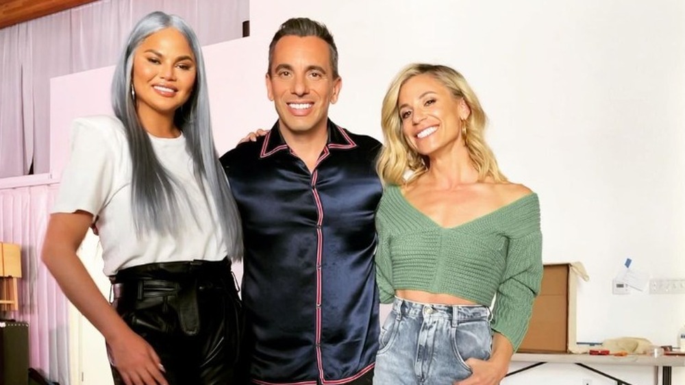 Chrissy Teigen poses with Sebastian Maniscalco and Lana Gomez