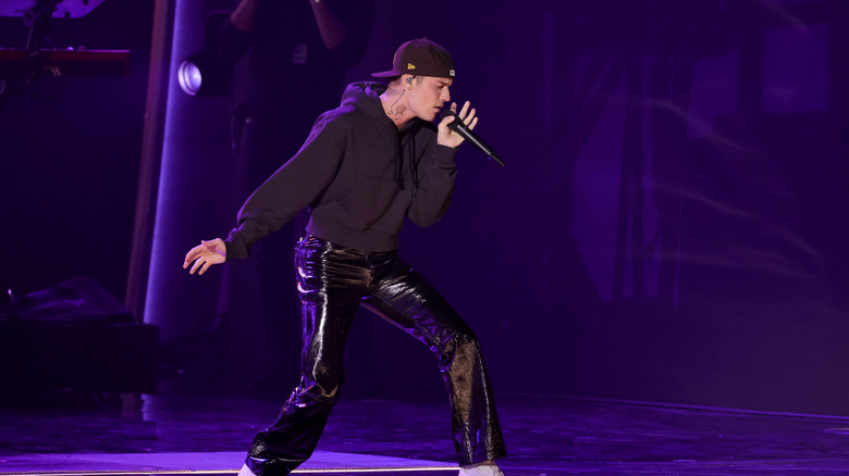 Justin Bieber performing at the 2022 Grammys in leather pants