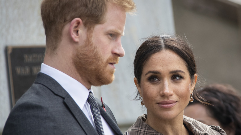 Meghan Markle looks at Prince Harry