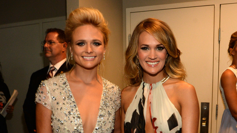 Carrie Underwood and Miranda Lambert smiling 