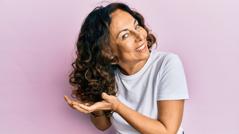 Woman with curly hair smiling