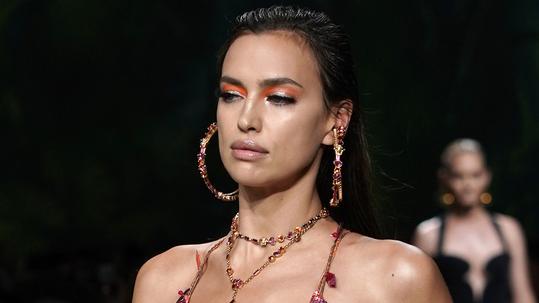 Model wearing hoop earrings and necklace, a 2020 fashion trend