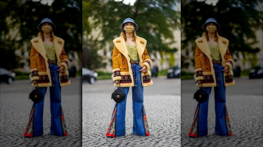 A model wearing '70s-inspired clothes during Paris Fashion Week 