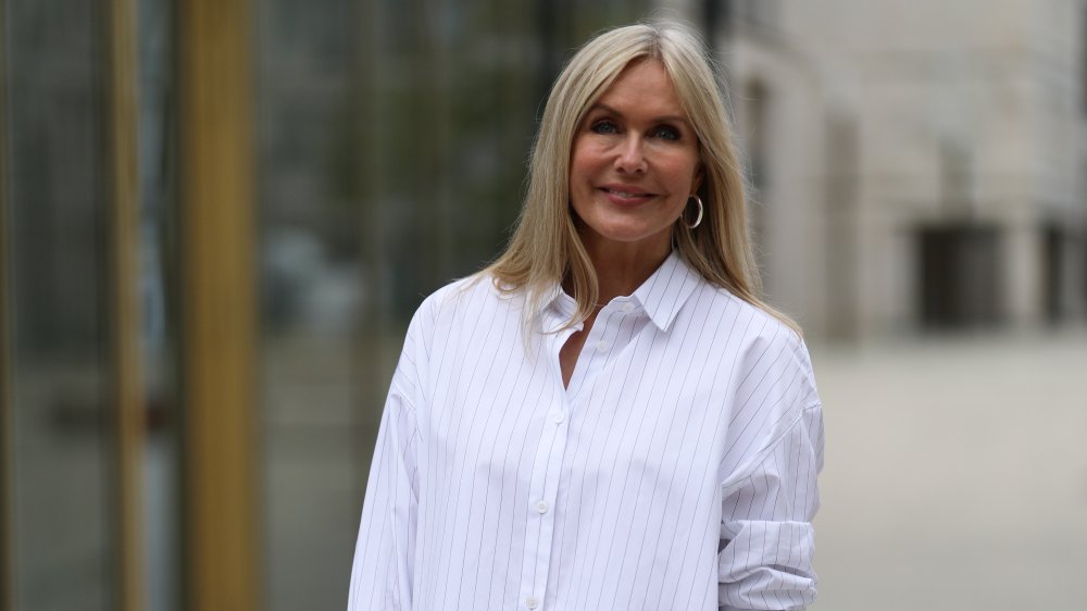 A woman wearing a button-down shirt