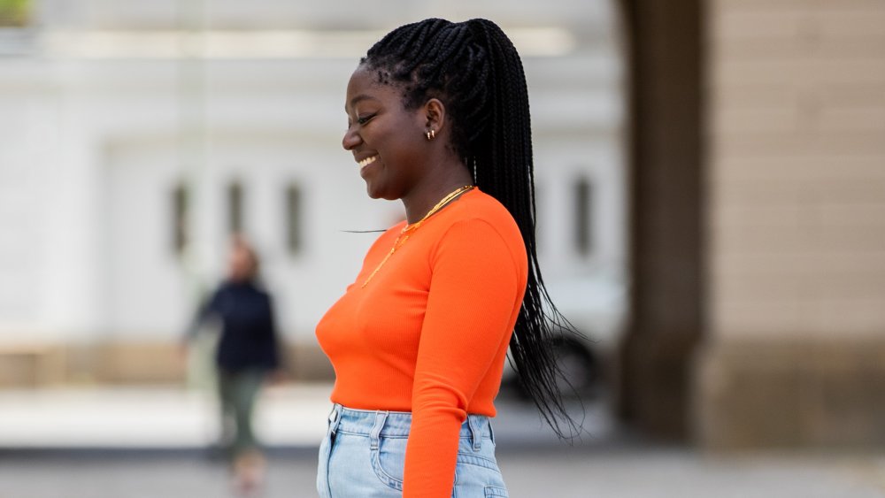 A woman wearing a JW Anderson sweater