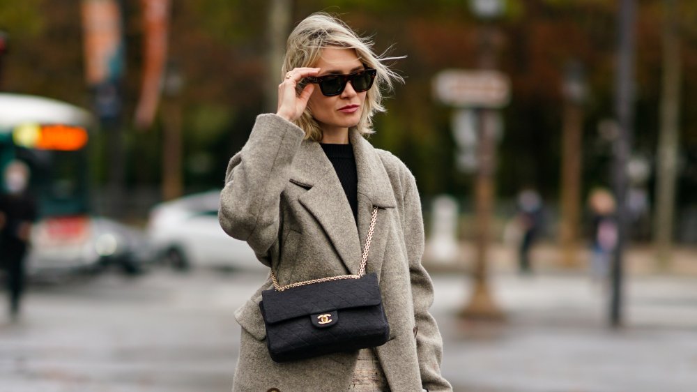 A woman wearing a cross-body bag