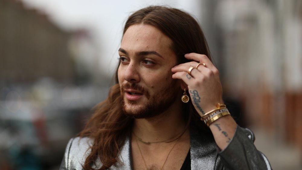 A model wearing gold jewelry 