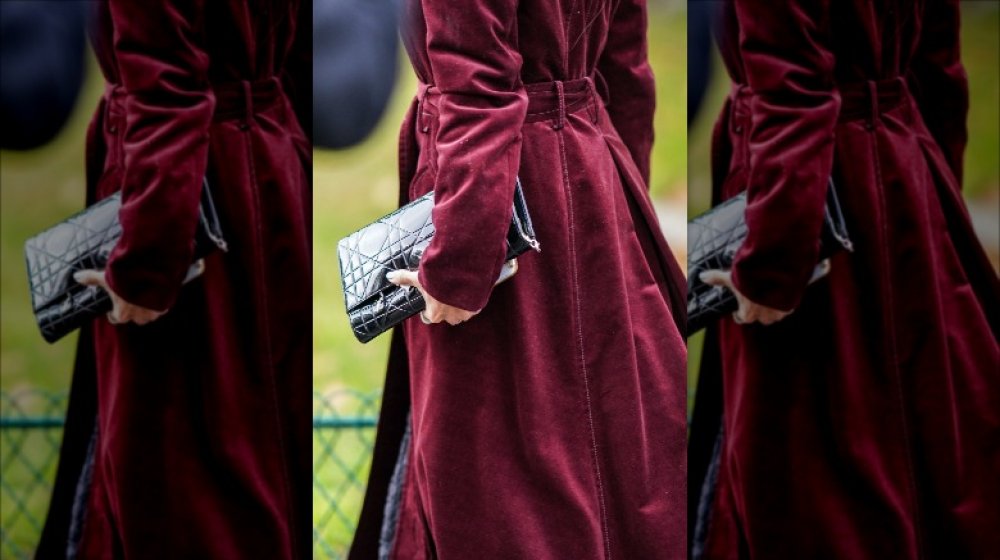 The back of a burgundy, velvet coat