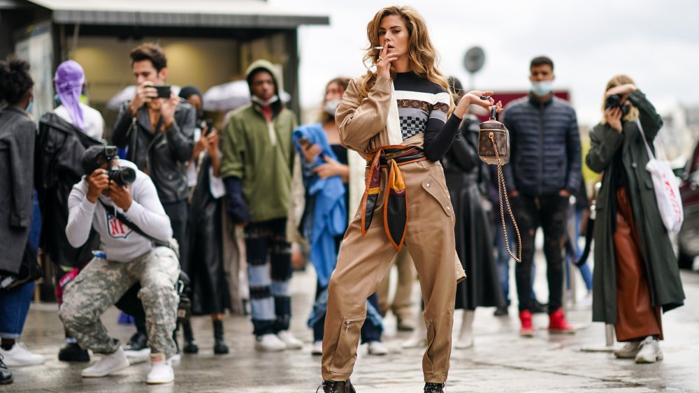 A woman posing during Paris Fashion Week 