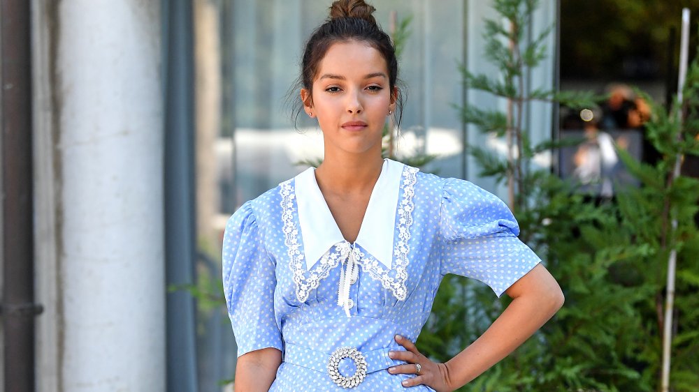 woman wearing blue dress with puffy sleeves