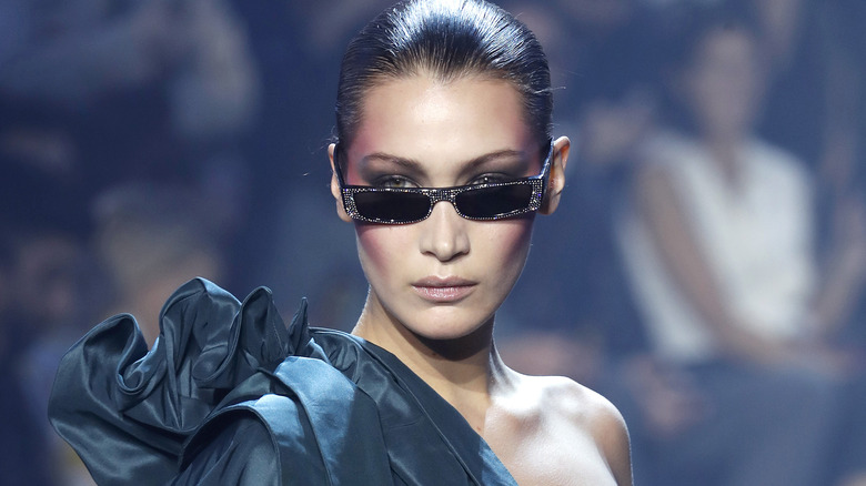 Tiny sunglasses, a fashion trend, on Bella Hadid