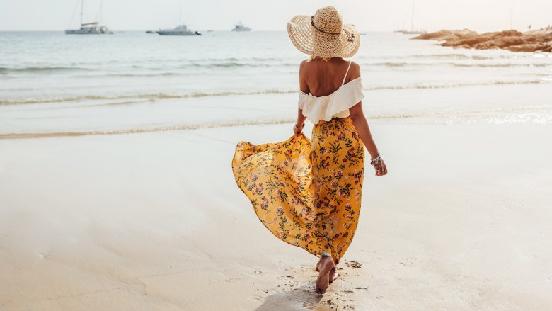 woman in maxi skirt on beach