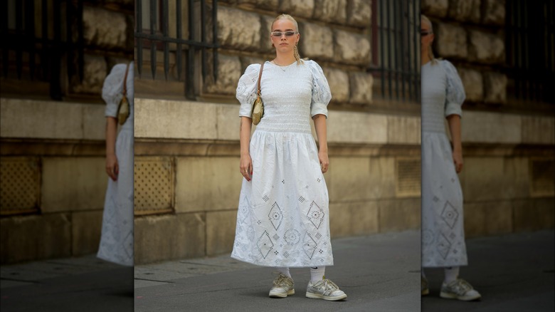 Woman in white dress on the street