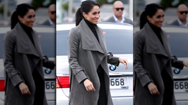 Meghan Markle wearing a trench coat 2018