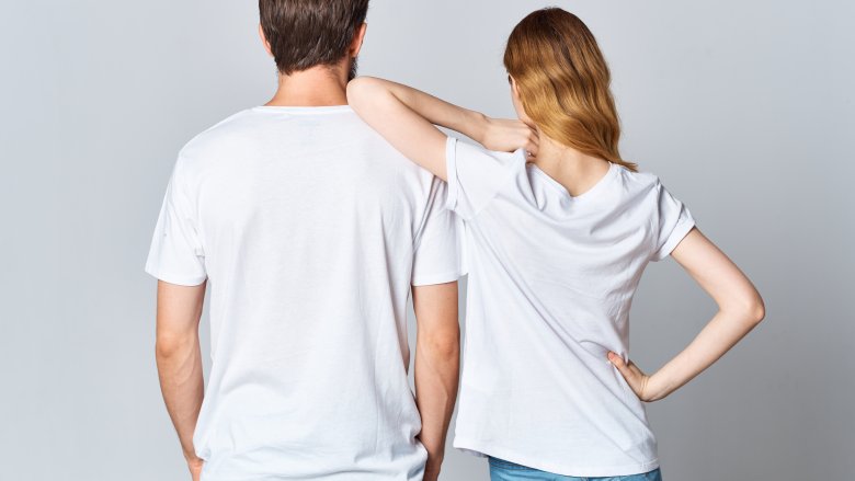 man and woman in white t-shirts