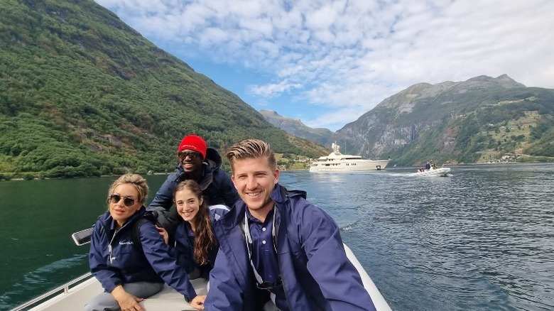 Faye Clarke with crew members at the bow