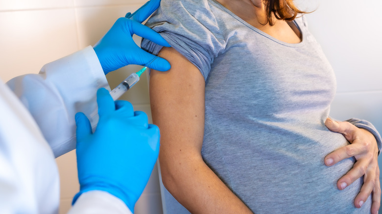 pregnant women getting an injection