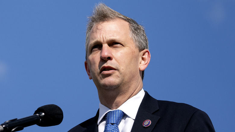 Congressman Sean Casten wears a blue tie and black blazer.