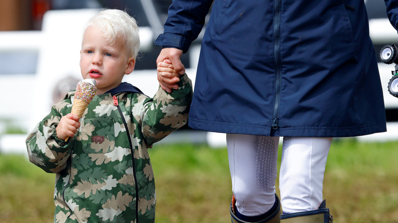 Zara Tindall holding son's hand 