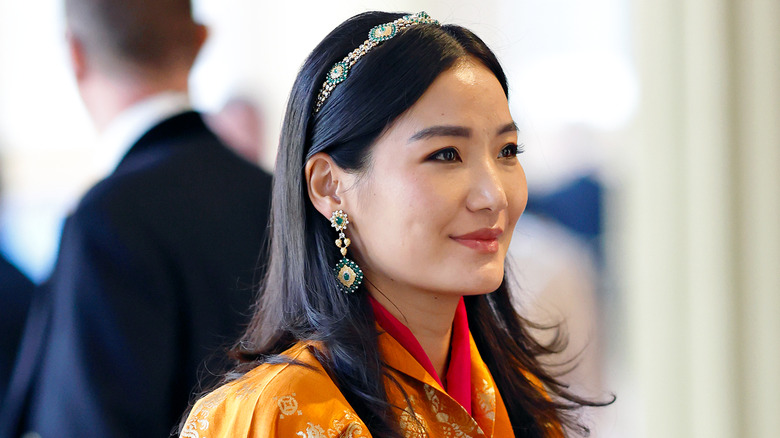 Jetsun Pema wearing orange, smiling