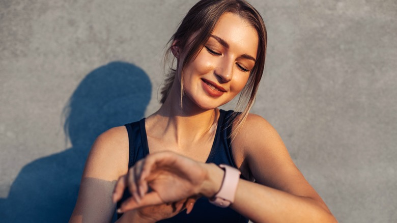 Woman looking at her smartwatch