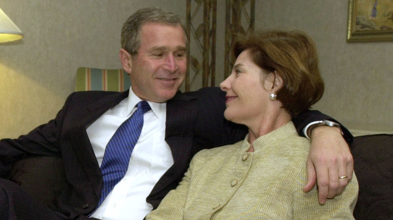 George W. and Laura Bush smiling and looking at each other