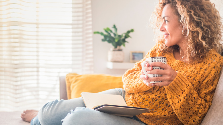 Woman holding a mug and relaxing