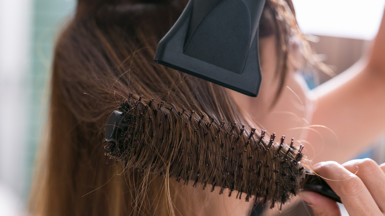 drying hair and styling with a round brush