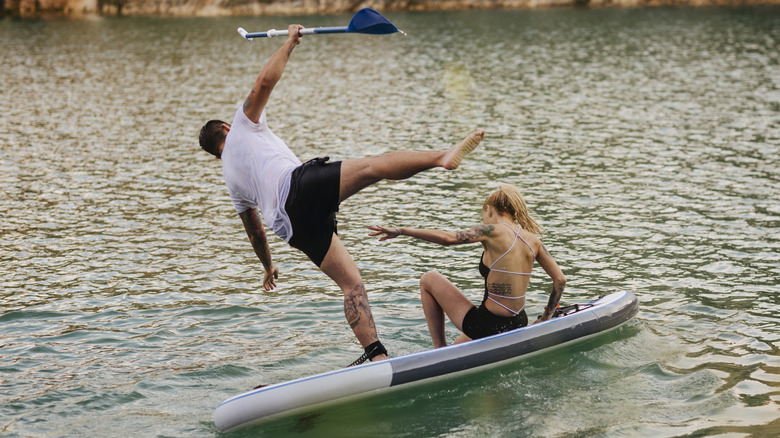 guy falling off kayak