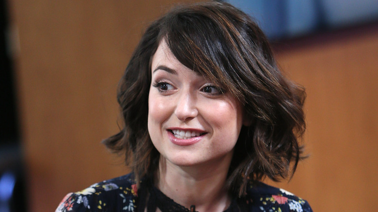 Milana Vayntrub speaking, looking to side