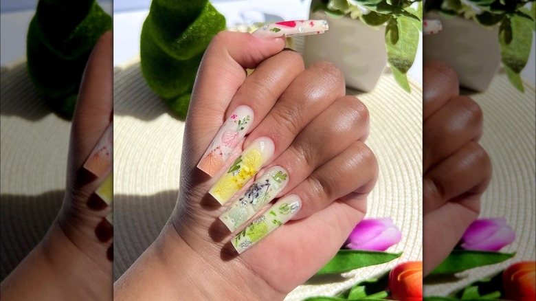 Square nails with a mixture of floral and leaf designs