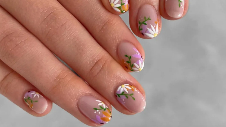 Nail art with flowers and vines.