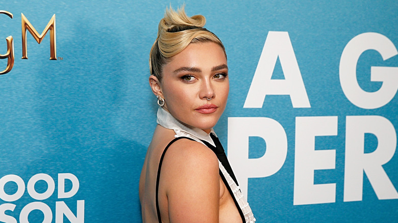 Florence Pugh looking over shoulder