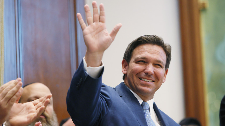 Ron DeSantis, smiling and waving