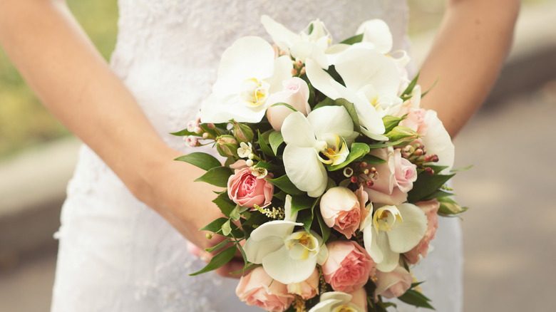 bride holding cascade bouquet