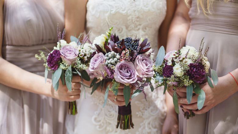 bride and bridesmaids holding bouquets