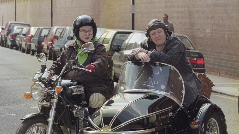 Jennifer Paterson and Clarissa Dickson-Wright on a motorcycle 