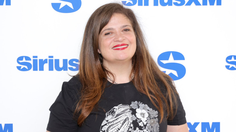 Alex Guarnaschelli smiling at a SiriusXM event in 2024