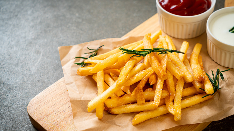 A plate of french fries and ketchup