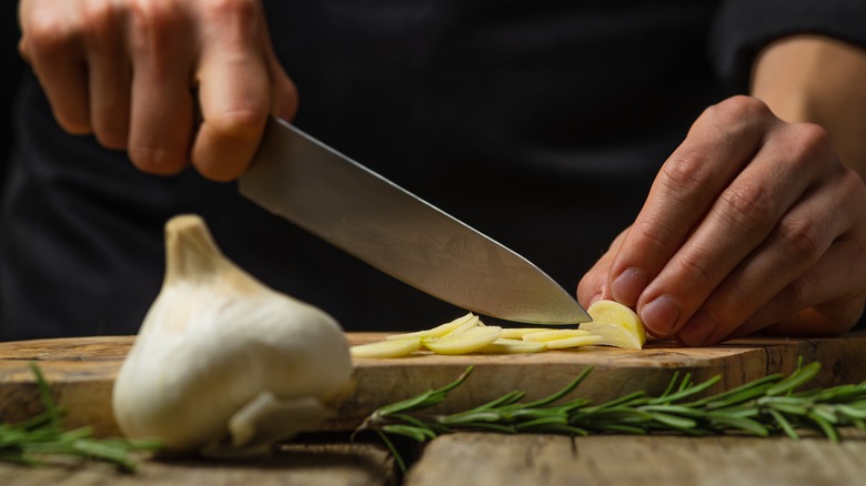 Hand chopping garlic