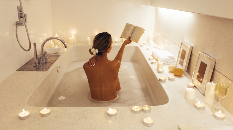 Woman reading in her bath