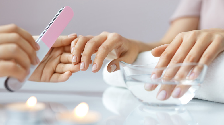 woman getting manicure