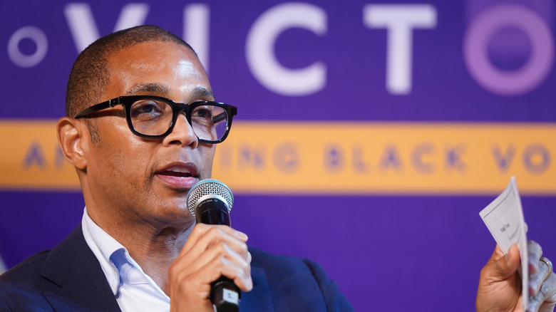 don lemon in glasses with microphone