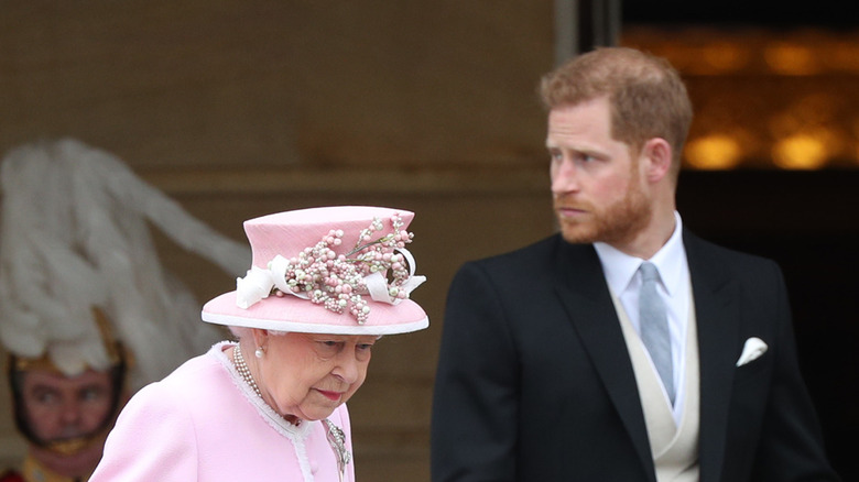 Harry walking with his grandmother the Queen