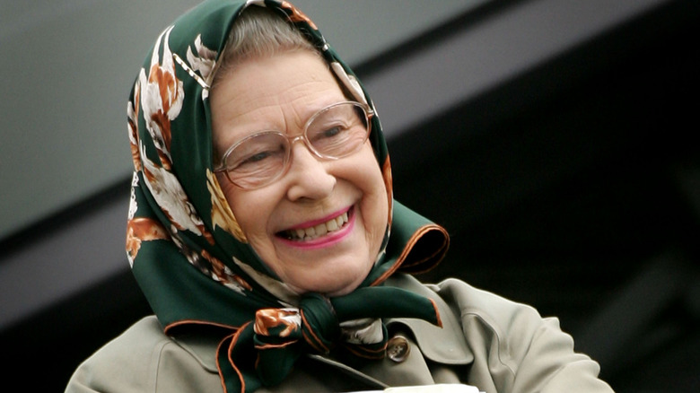 Queen Elizabeth in headscarf smiling