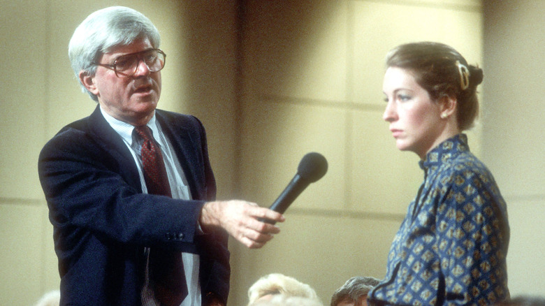 Phil Donahue interviews an audience member in 1985