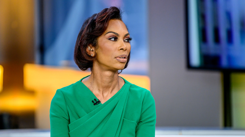 Harris Faulkner staring to the side in green shirt