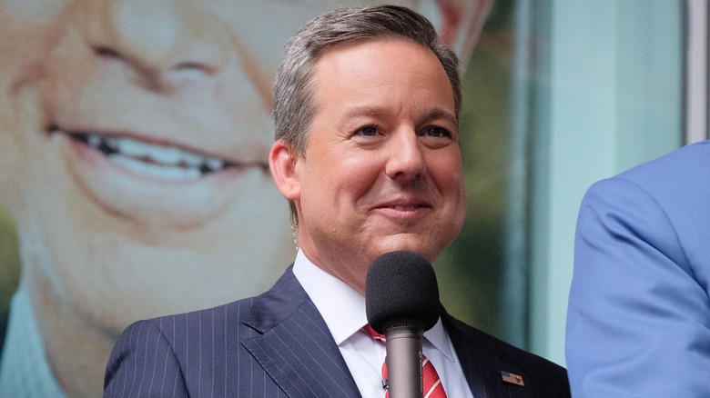 Ed Henry speaking into microphone